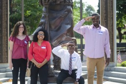 Teens pose outside The Castle Group during a job shadow day