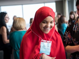 Student smiling and celebrating at WriteBoston's Pros&Conversation fundraiser