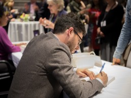 Joshua Foer signing books