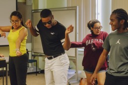 teens in print students dancing in class