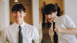 student writer jacob downey smiling and pointing at the camera