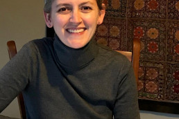 kelly on the computer smiling