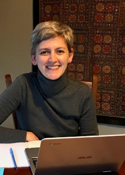 kelly on the computer smiling