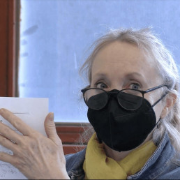 Teacher holds up a handout to share with other educators